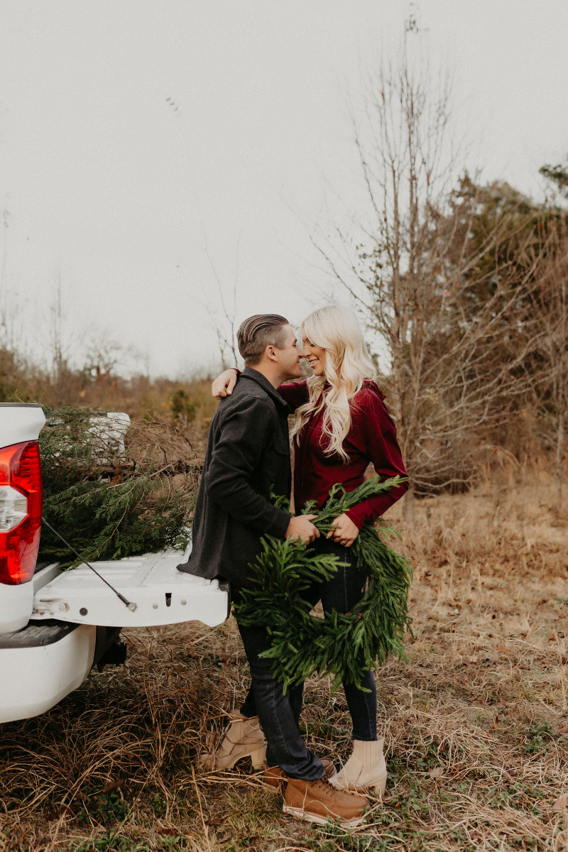 Couple wearing Woolx sitting on tailgate wearing Woolx.