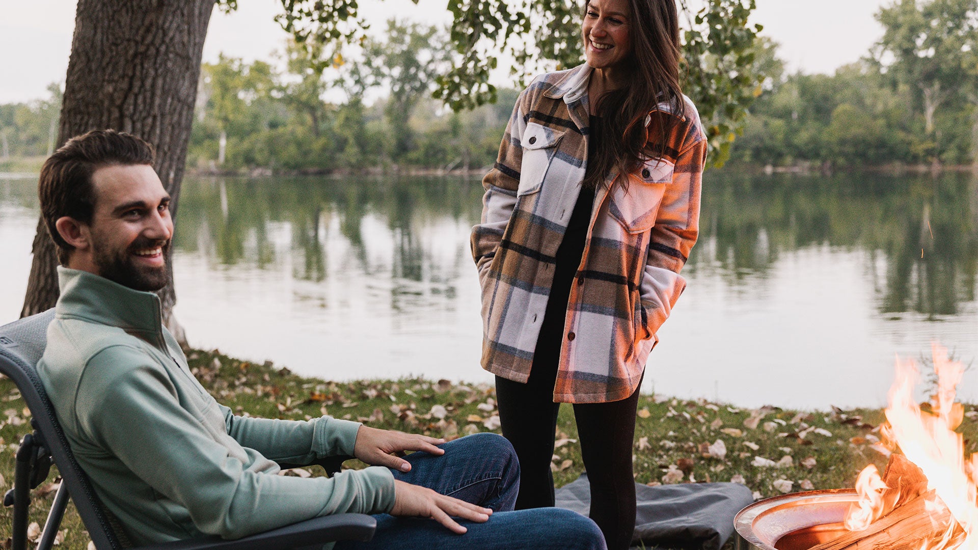 Woman wearing Sawyer Shacket and Man wearing Mason quarter zip