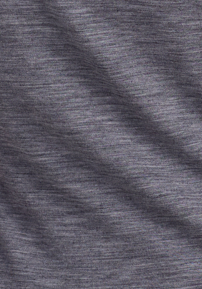 Close-up of the Woolx Junie V Neck in Graphite Heather, showcasing its soft Merino wool fabric with subtle horizontal texture, blended fibers, and gentle folds for a slightly mottled look.