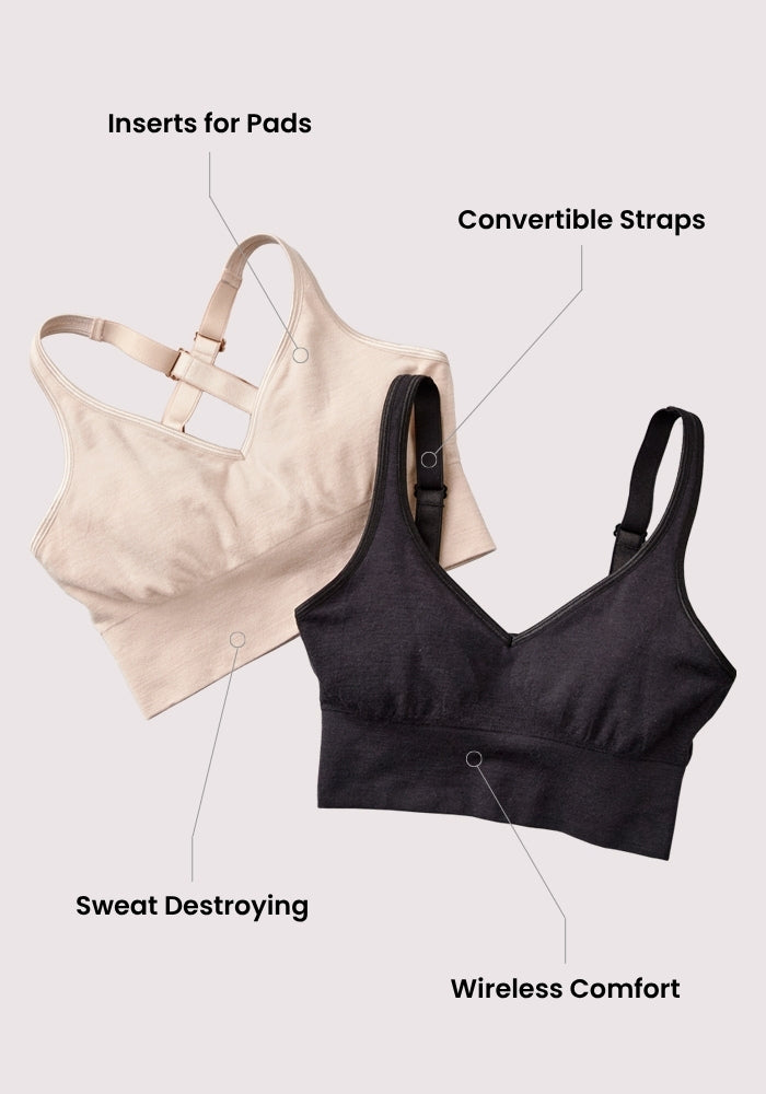Two Woolx Hayden Bras in Sand and Black are laid flat on a light background. Labels highlight features: pad inserts, convertible straps, odor-resistant Merino wool, sweat control, and seamless comfort.