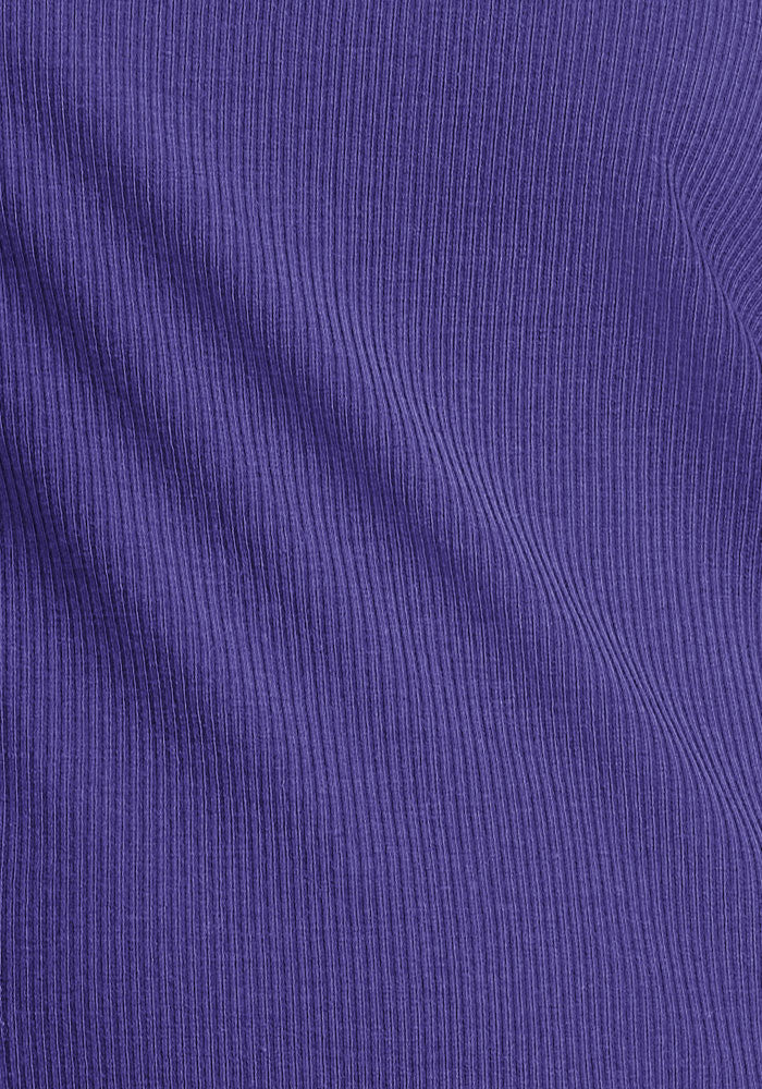 Close-up of the Woolx Vivi Ribbed Tank in Berry Indigo, showcasing vertical ribbed texture and soft shadows.
