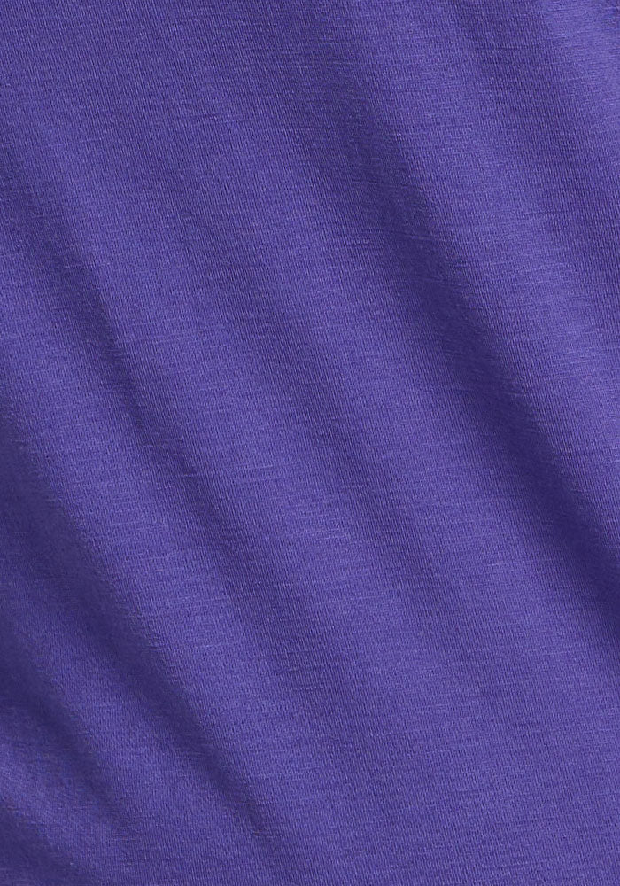 Close-up of the Woolx Mia V Neck in Berry Indigo, featuring visible Merino wool texture and subtle diagonal wrinkles.