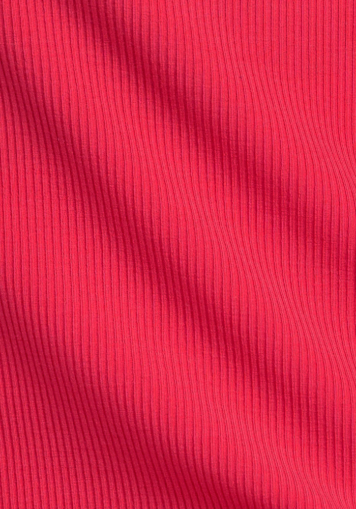 Close-up of Woolx Iris Ribbed Dress - Berry Ice Pop fabric with vertical rib texture and soft, wavy shadows.