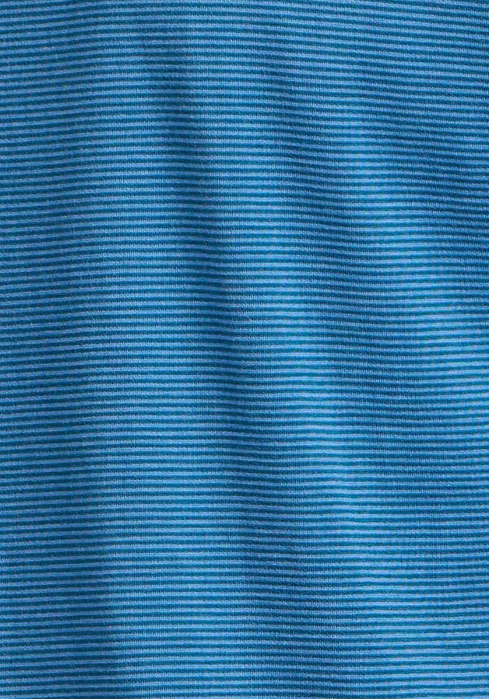 Close-up of the Woolx Reaction Boxer Briefs - Coastal Mini Stripe shows blue fabric with thin, horizontal ribbed texture and gentle folds, highlighting chafe-free comfort ideal for performance underwear.