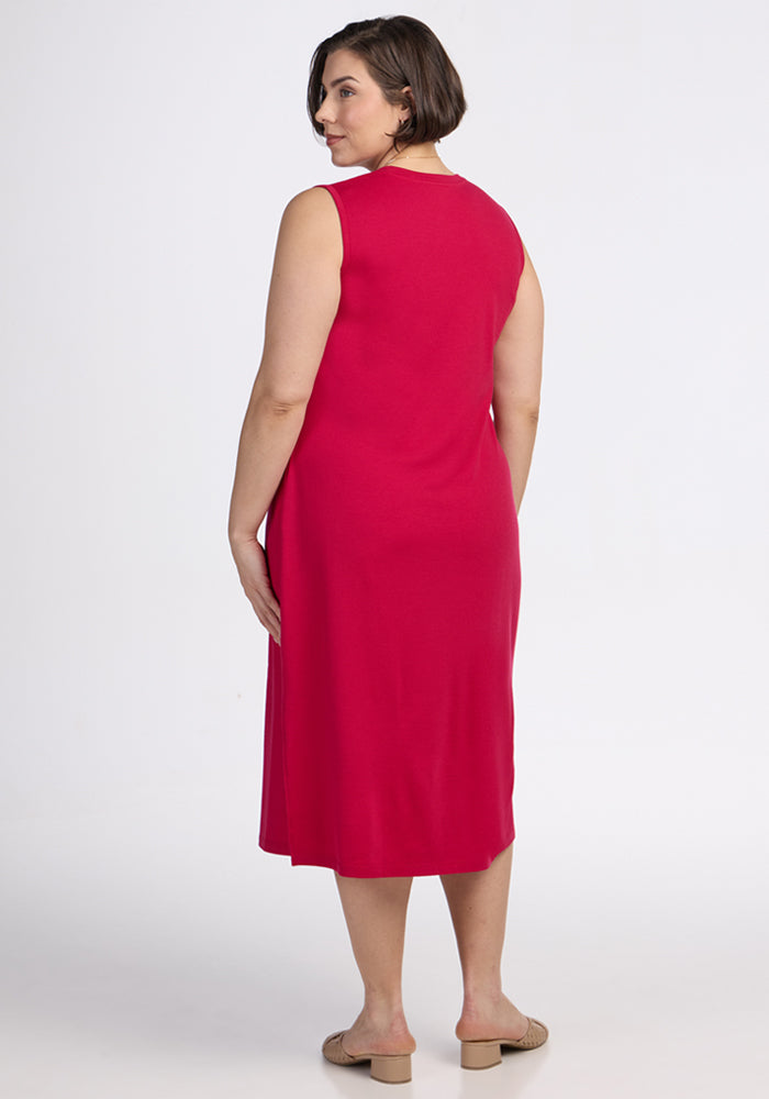 Woman with short brown hair wears the Woolx Cassie Dress in Poppy Spark, back to camera. Final Sale.