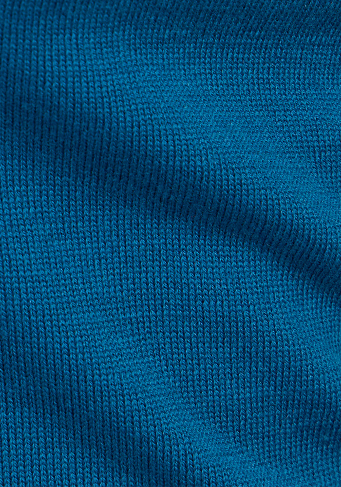 Close-up of the Woolx Chessy Tank Top in Moroccan Blue, featuring textured ribbing and soft knit fabric—this sleeveless style is perfect for versatile layering.