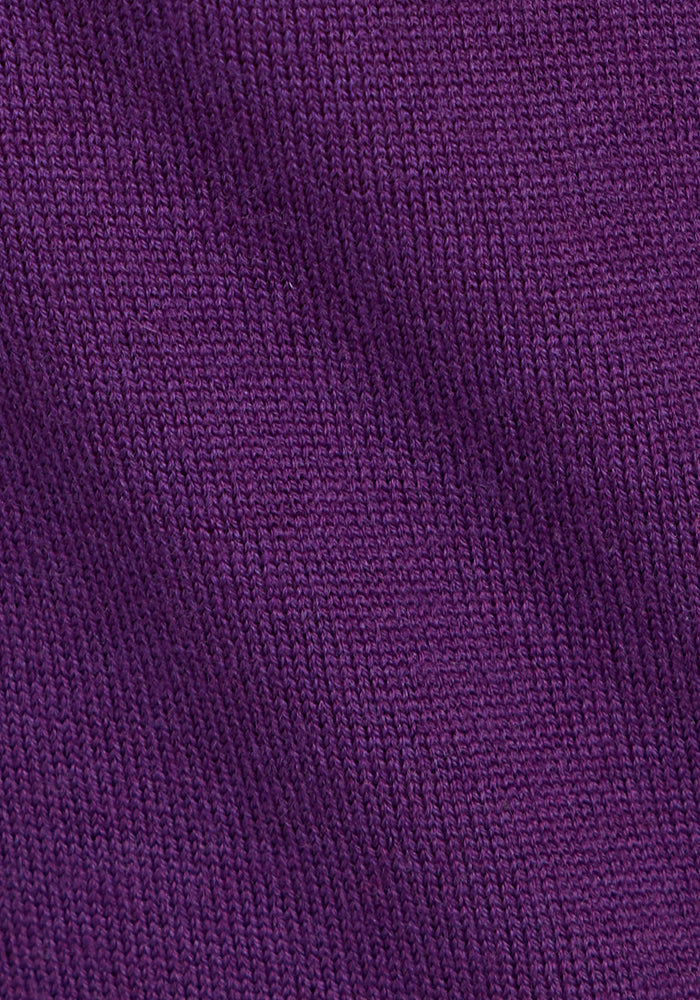 Close-up of the Woolx Collins Half Zip Sweater in Plum Crush, highlighting its merino wool texture, diagonal weave pattern, and visible stitching detail.