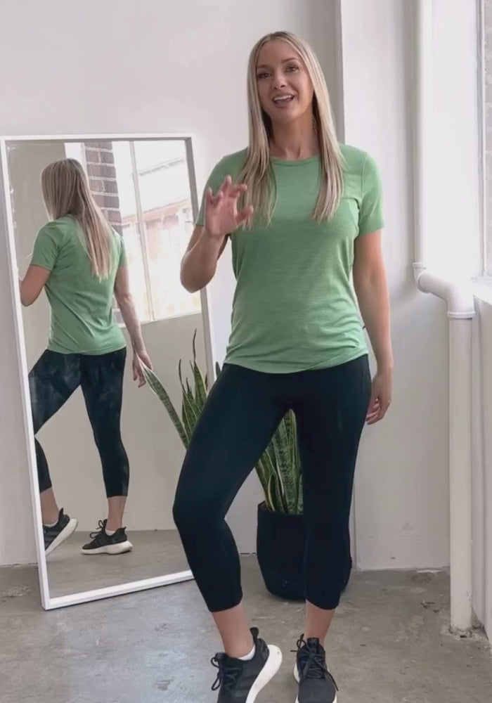 Model wearing black Mckenna capris showing the features and benefits