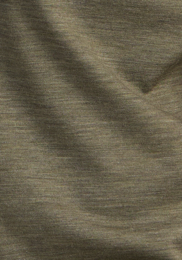 Close-up of the Woolx Endi Full Button Down Shirt in Sage Olive Melange, highlighting its soft, lightweight wool fabric with a gently heathered texture and subtle folds.