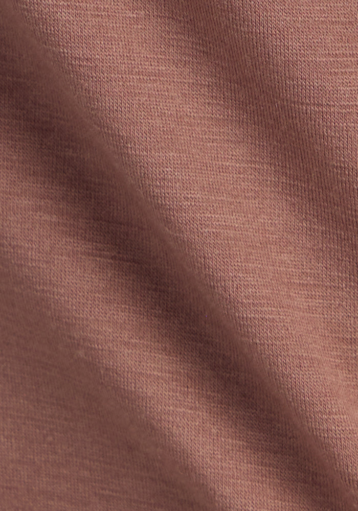 Close-up of Woolx Liza Crew Neck Tee in Sienna Kiss, featuring soft Merino wool knit and a diagonal shadow.