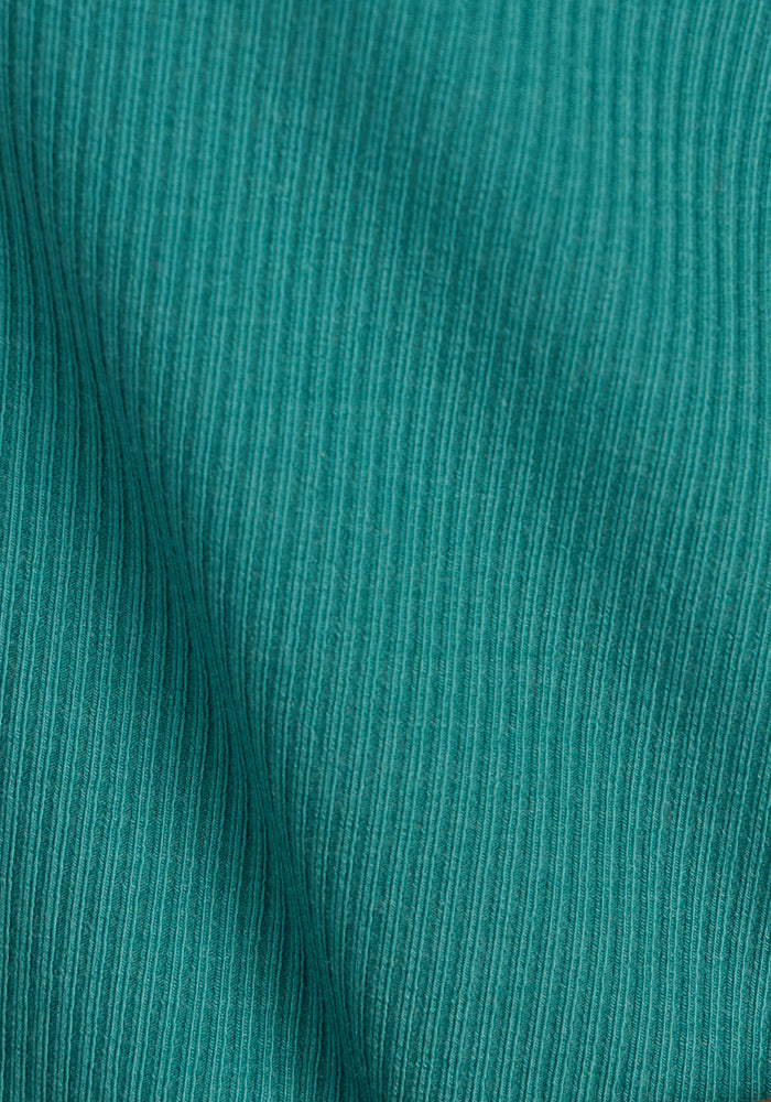 Woolx Delia Ribbed Short Sleeve in Surfside: teal, moisture-wicking fabric with fine vertical texture.