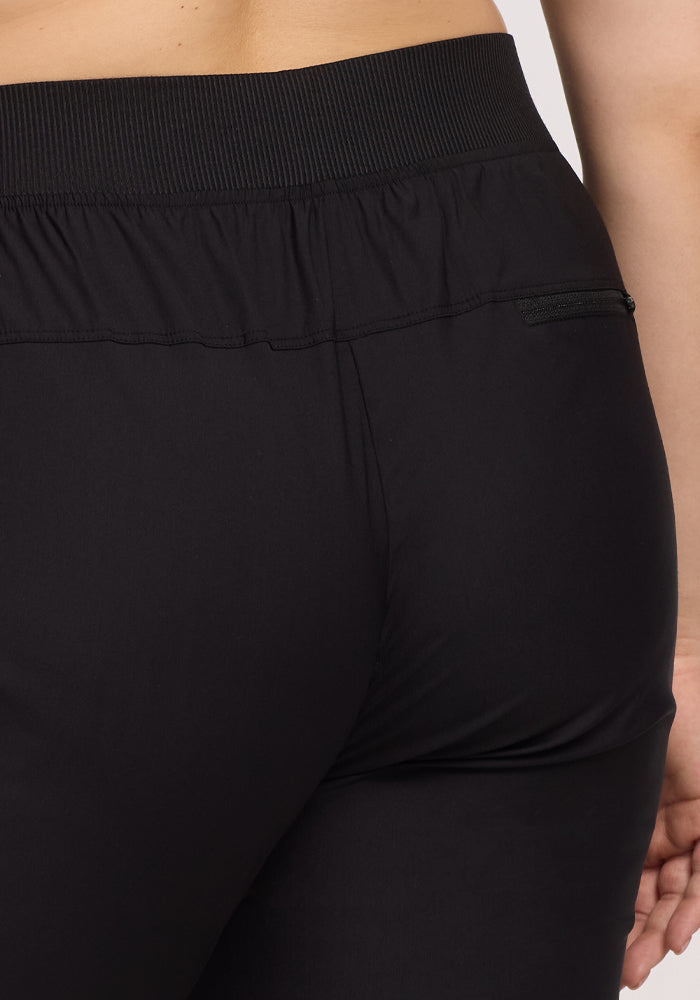 The Palmer Joggers - Black by Woolx feature a ribbed, stretchy waistband at the back view. Made with smooth Merino fabric for added comfort, they also include a small zipper pocket on the right near the waistband, ideal for storing essentials.