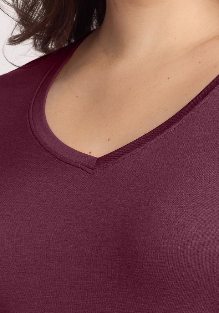 Close-up of the Woolx Millie Long Sleeve in Grape Harvest, featuring a V-neckline and part of the shoulder.